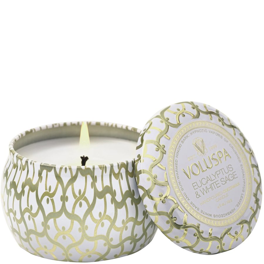 Voluspa candle with decorative lid on a white background