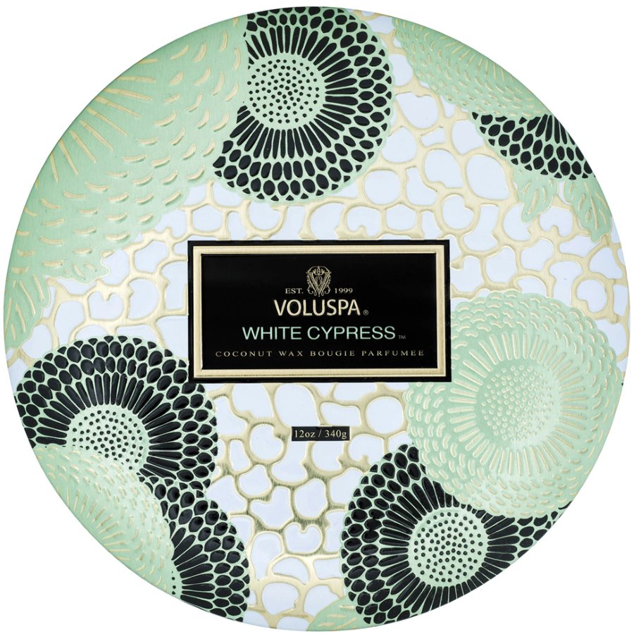 Voluspa White Cypress candle packaging with decorative design