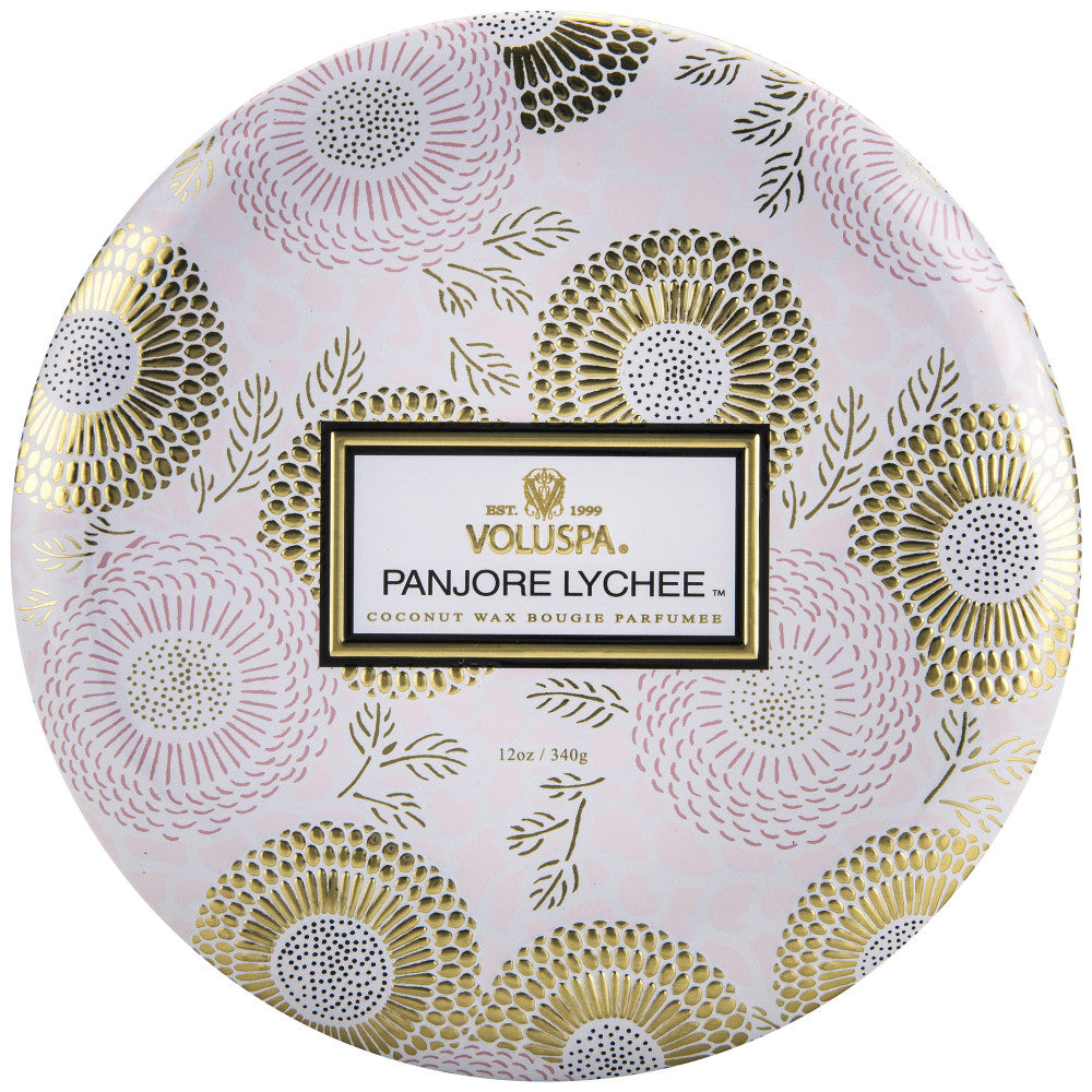 Round Voluspa Panjore Lychee scented candle packaging with floral design