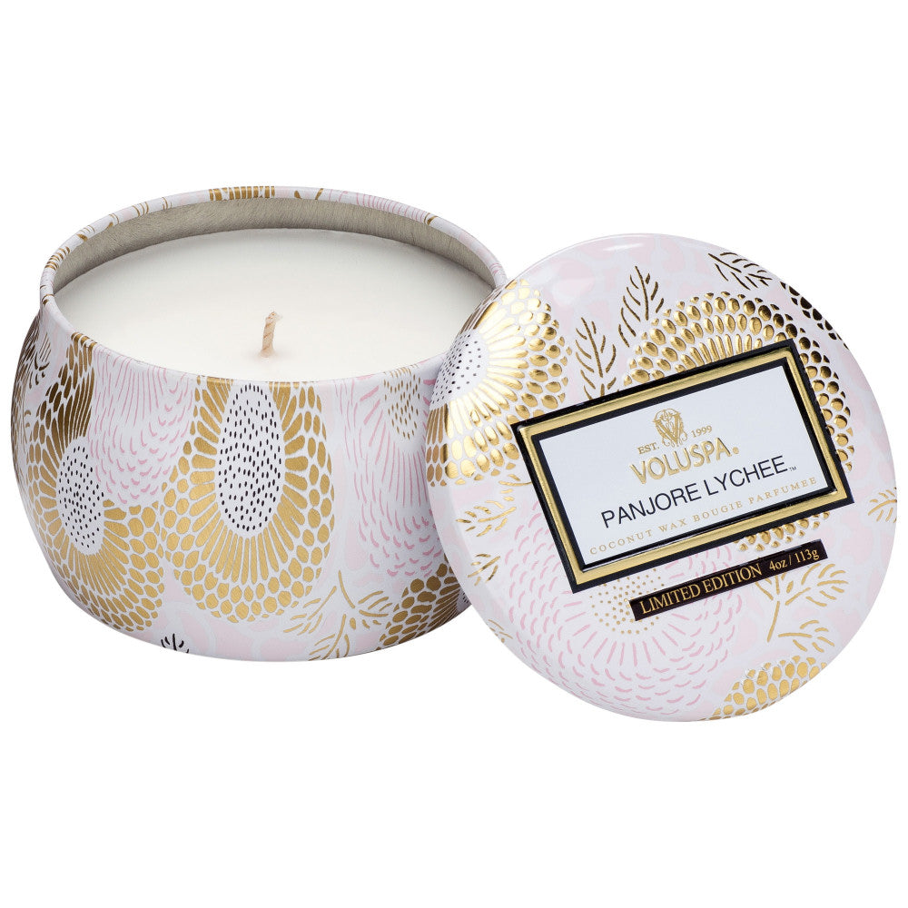 Votive candle in a decorative tin with gold patterns and 'Voyuspa' branding.