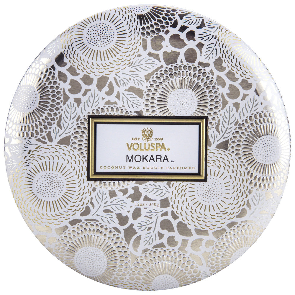 Decorative packaging of Voluspa Mokara coconut wax bougie on a white background