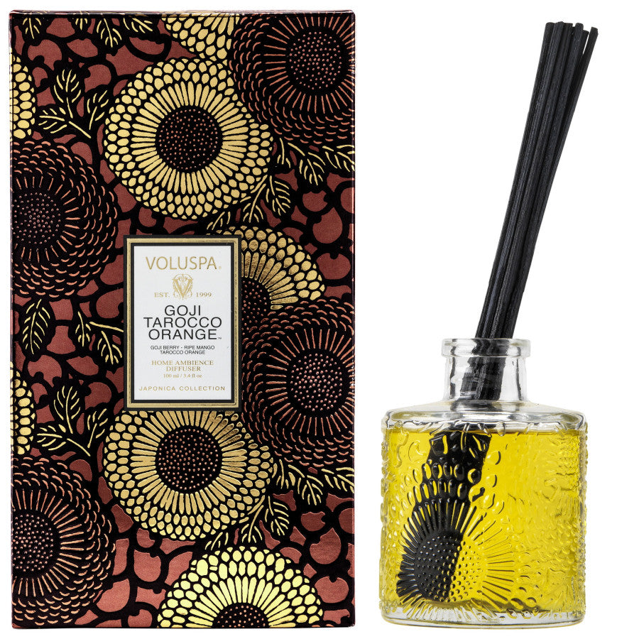 Voluspa diffuser set with decorative box and glass bottle on a white background