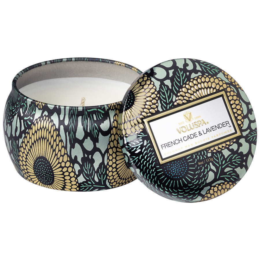 Decorative candle in a patterned tin with 'Viluspa' branding on a white background
