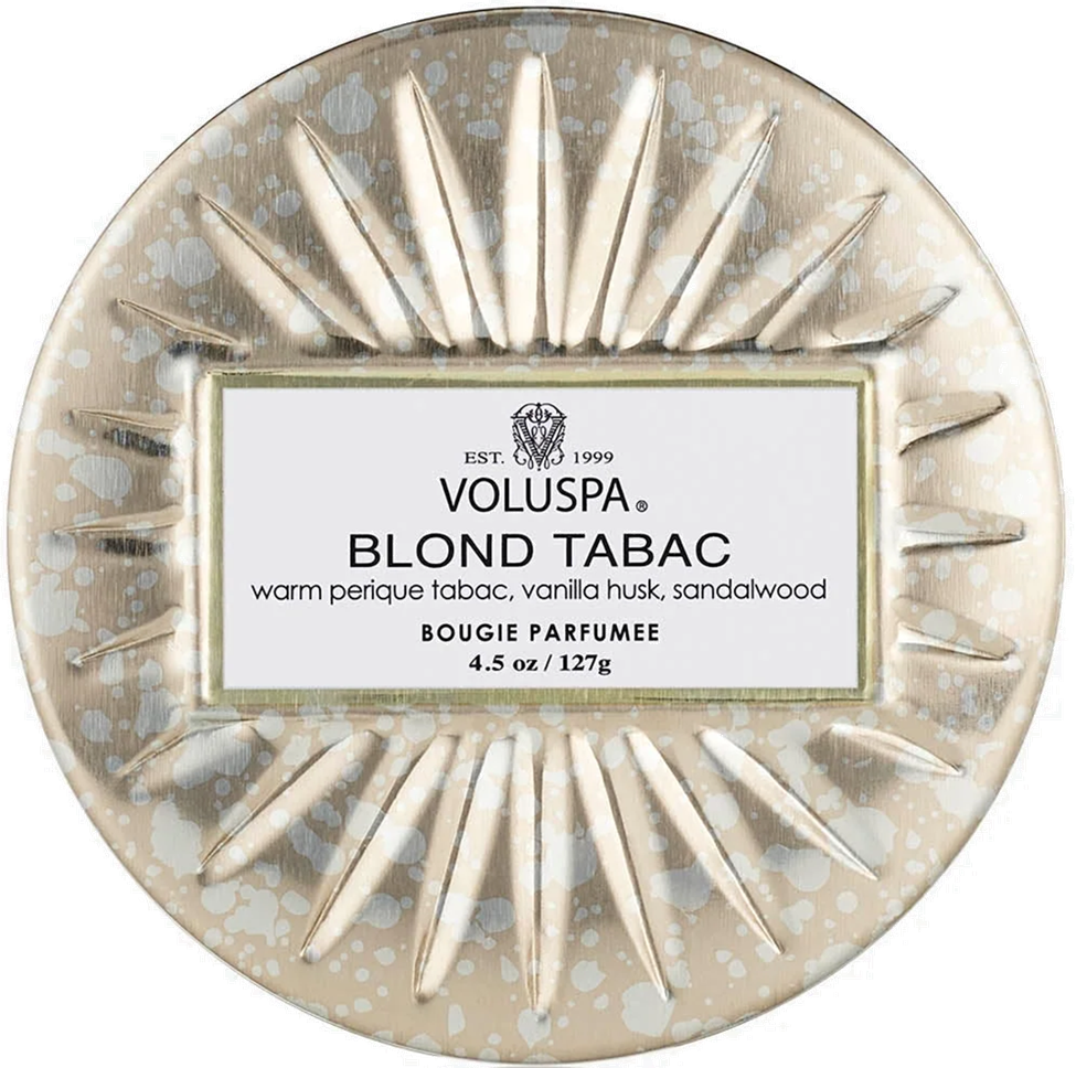 Round Voluspa Blond Tabac candle packaging with decorative design and label.