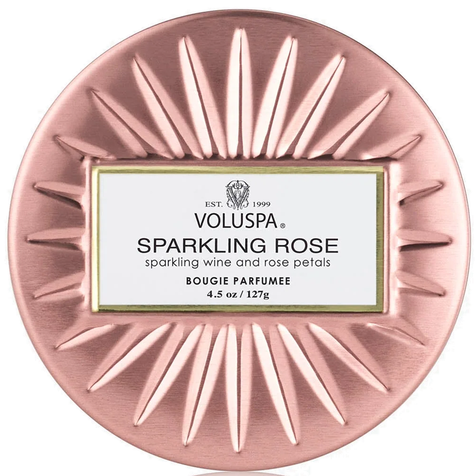Voluspa Sparkling Rose candle in a decorative pink holder on a white background