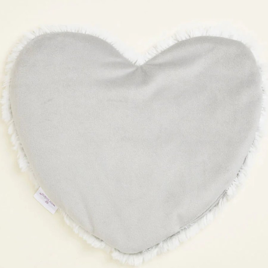 Heart-shaped gray pillow with white trim on a white background