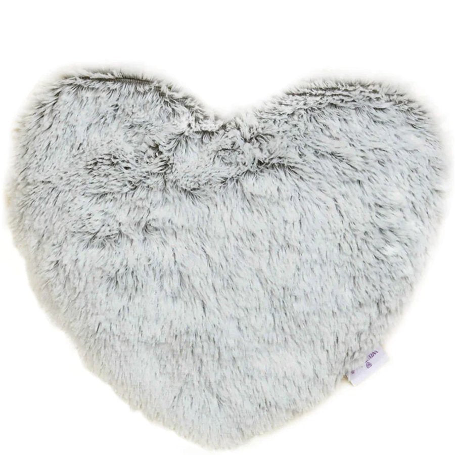 Heart-shaped fluffy pillow on a white background