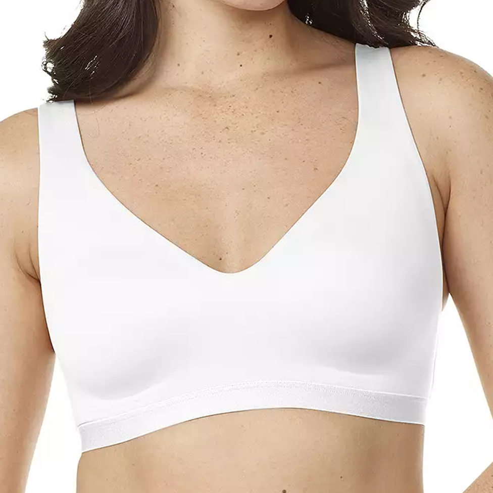 White sports bra worn by a person on a white background