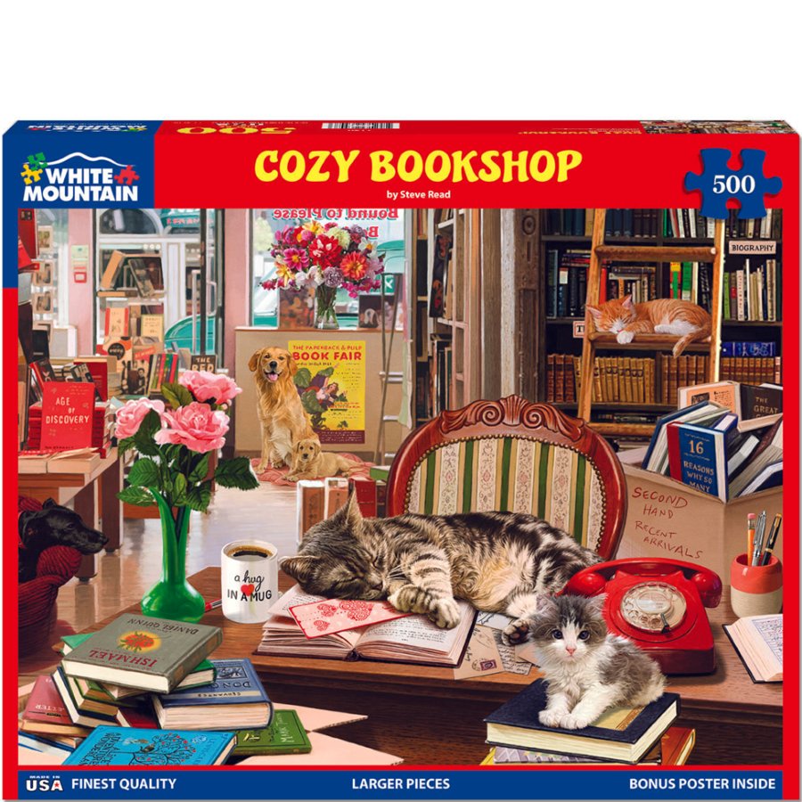 Jigsaw puzzle box for 'Cozy Bookshop' by White Mountain Puzzles with a cat and dog on a bookshelf.