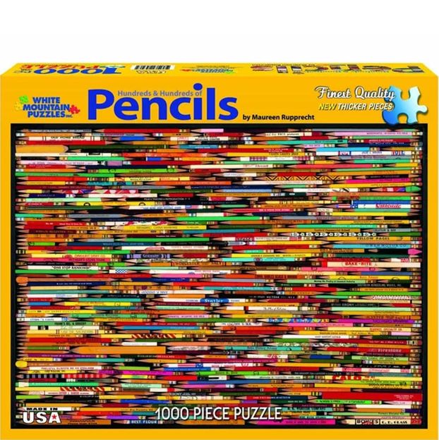 Puzzle box with colorful pencils design and 'White Mountain Puzzles' branding.