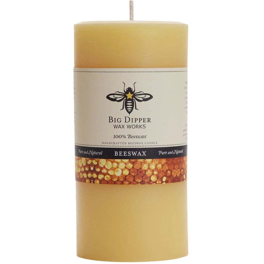 Beeswax candle with Big Dipper Wax Works label on a white background