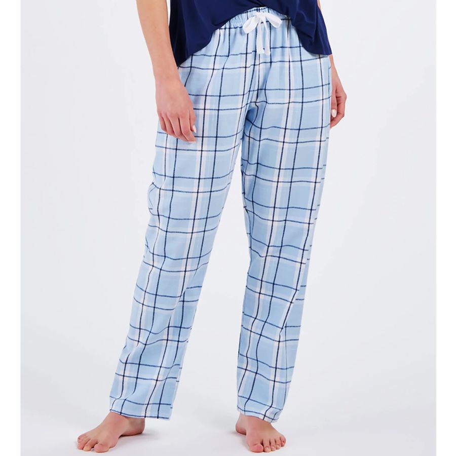 Person wearing blue plaid pajama pants on a white background