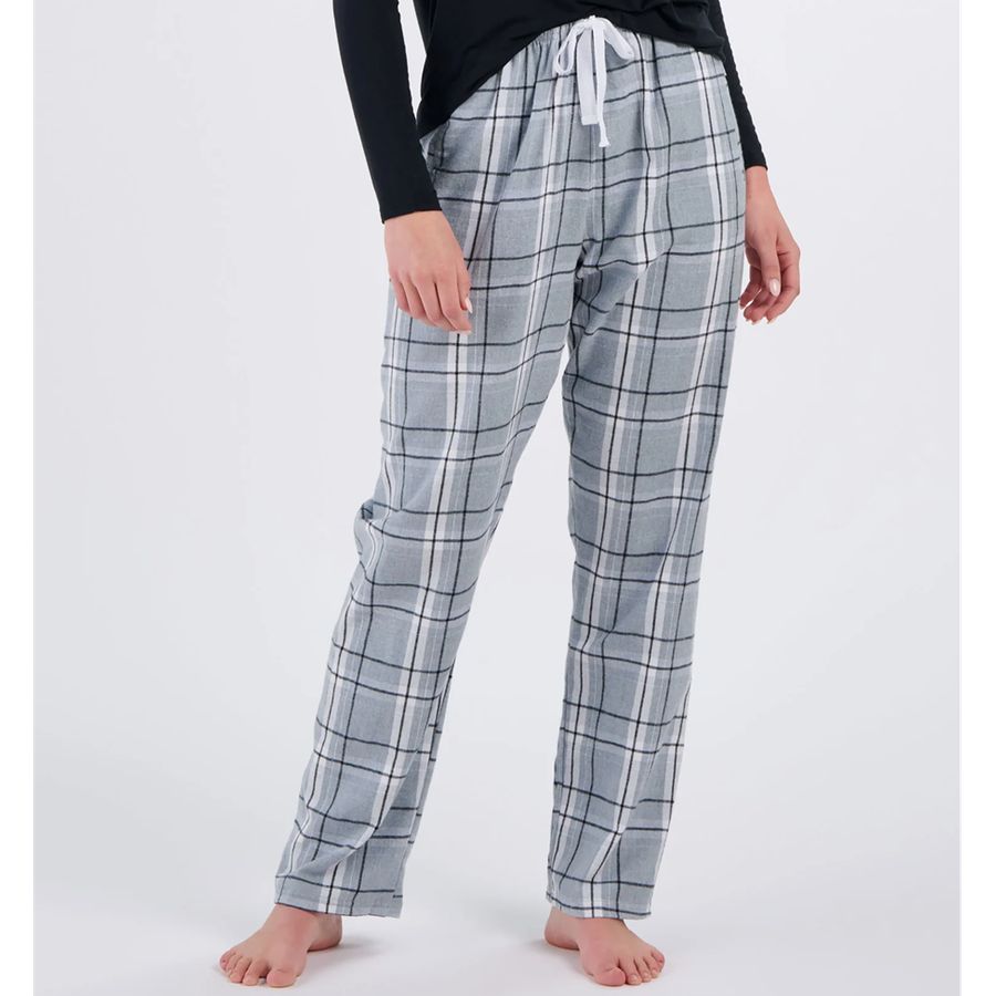 Plaid pajama pants worn by a person on a white background