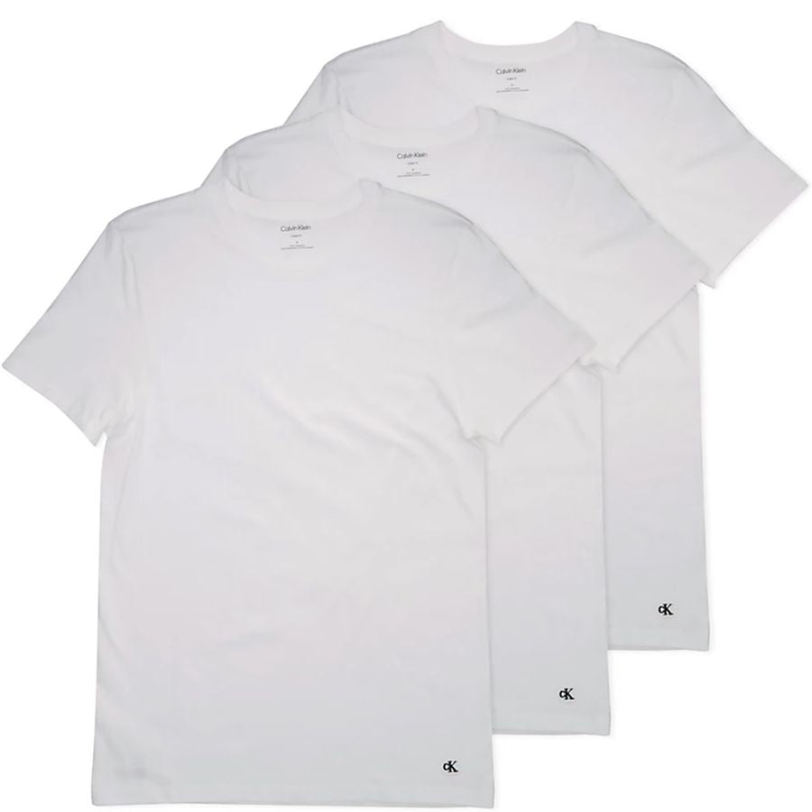 Three white short-sleeve crewneck t-shirts from Calvin Klein, arranged in a stacked fan layout on a white background, with the Calvin Klein logo visible on the inner neck labels and lower hem.