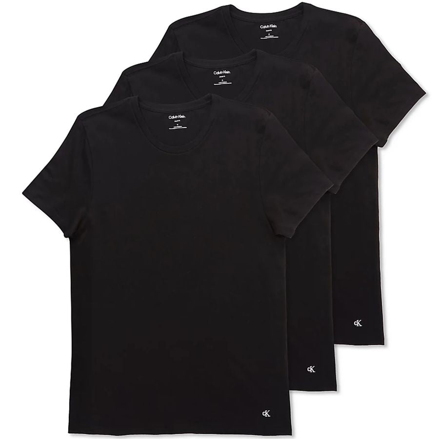 Three black short-sleeve crewneck t-shirts from Calvin Klein, arranged in a stacked fan layout on a white background, with the Calvin Klein logo visible on the inner neck labels and lower hem.