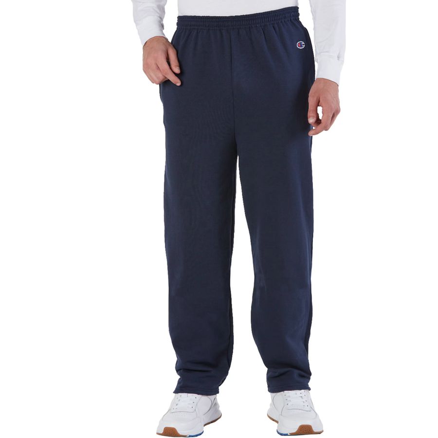 Navy sweatpants worn by a person on a white background