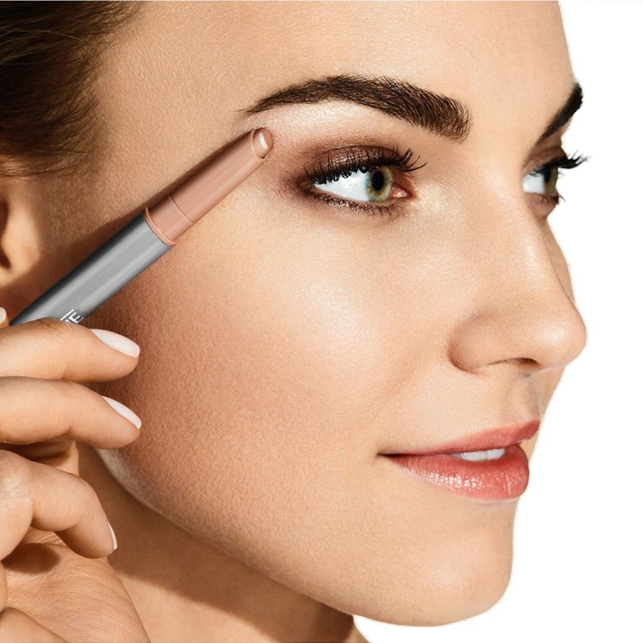 Woman applying eyebrow pencil to her eyebrows with a close-up focus on the face.