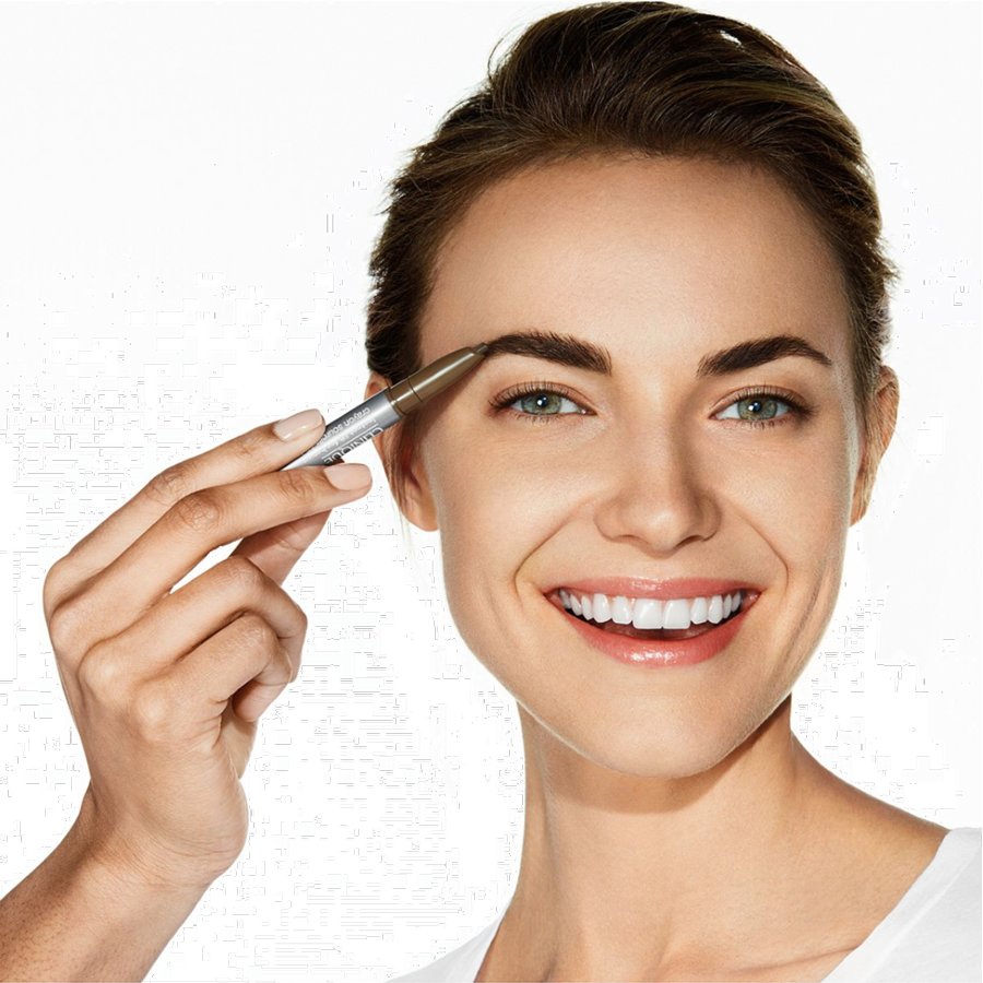 Woman applying eyebrow makeup with a brush on a white background