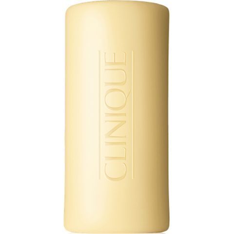 Yellow bar of soap with 'Clinique' branding on a white background