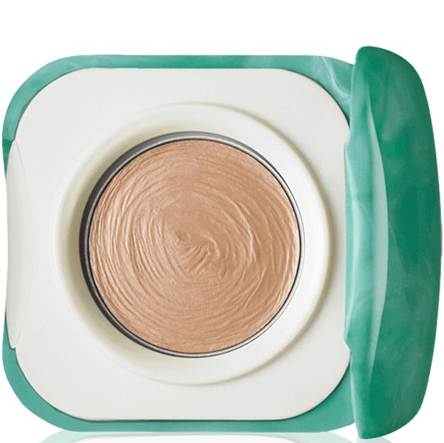 Compact powder in a teal and white case on a white background
