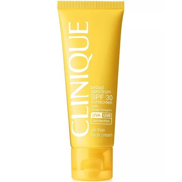 Yellow Clinique sunscreen tube on a white background