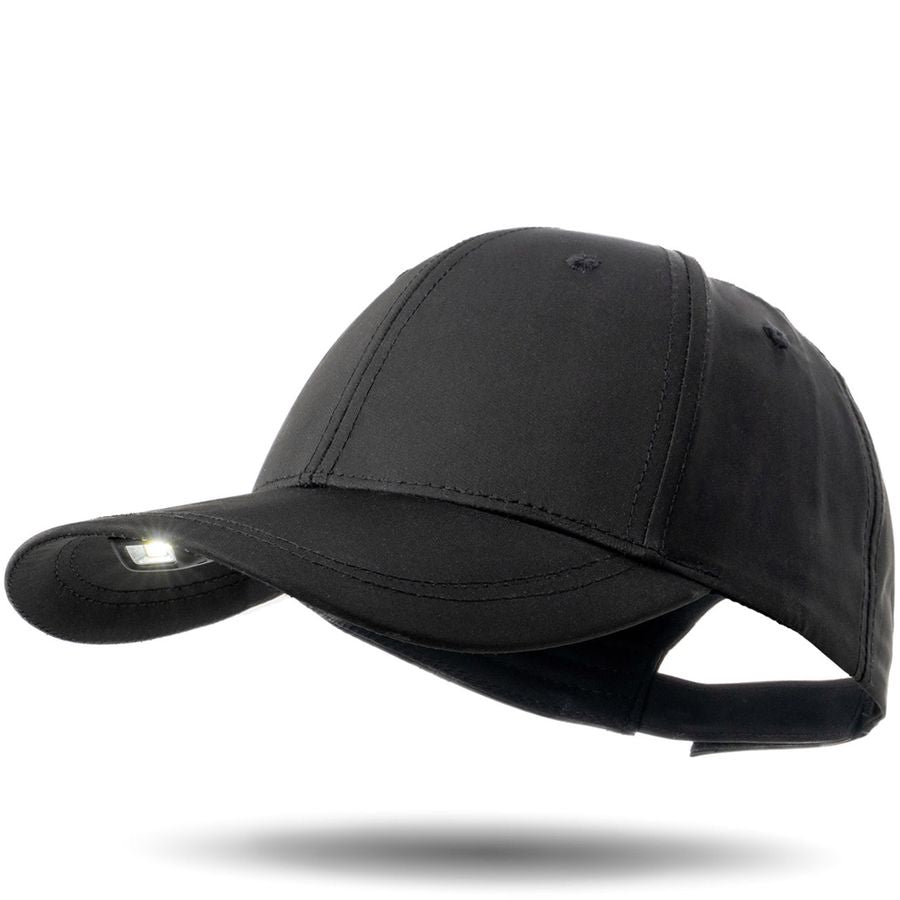 Black baseball cap with LED light on a white background