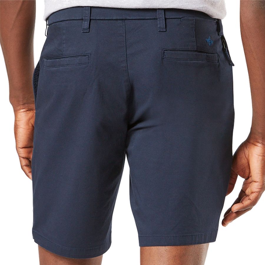 Navy blue shorts worn by a person on a white background