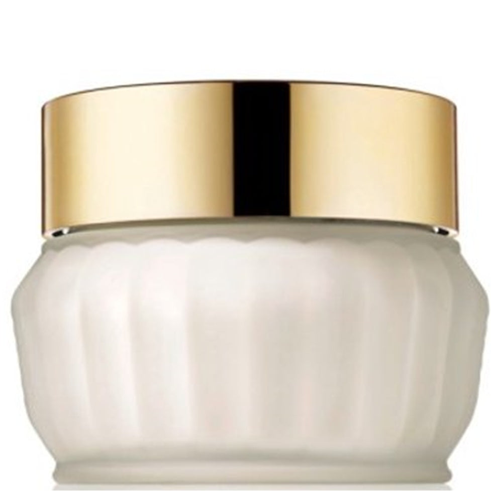 White jar with a gold lid on a white background
