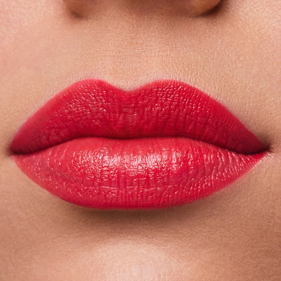 Close-up of a person's lips wearing a bright red lipstick.