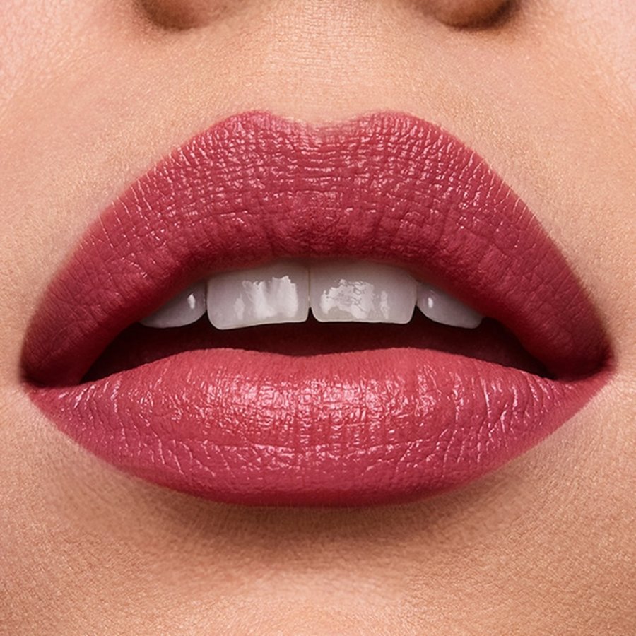 Close-up of a person's lips wearing a pink lipstick