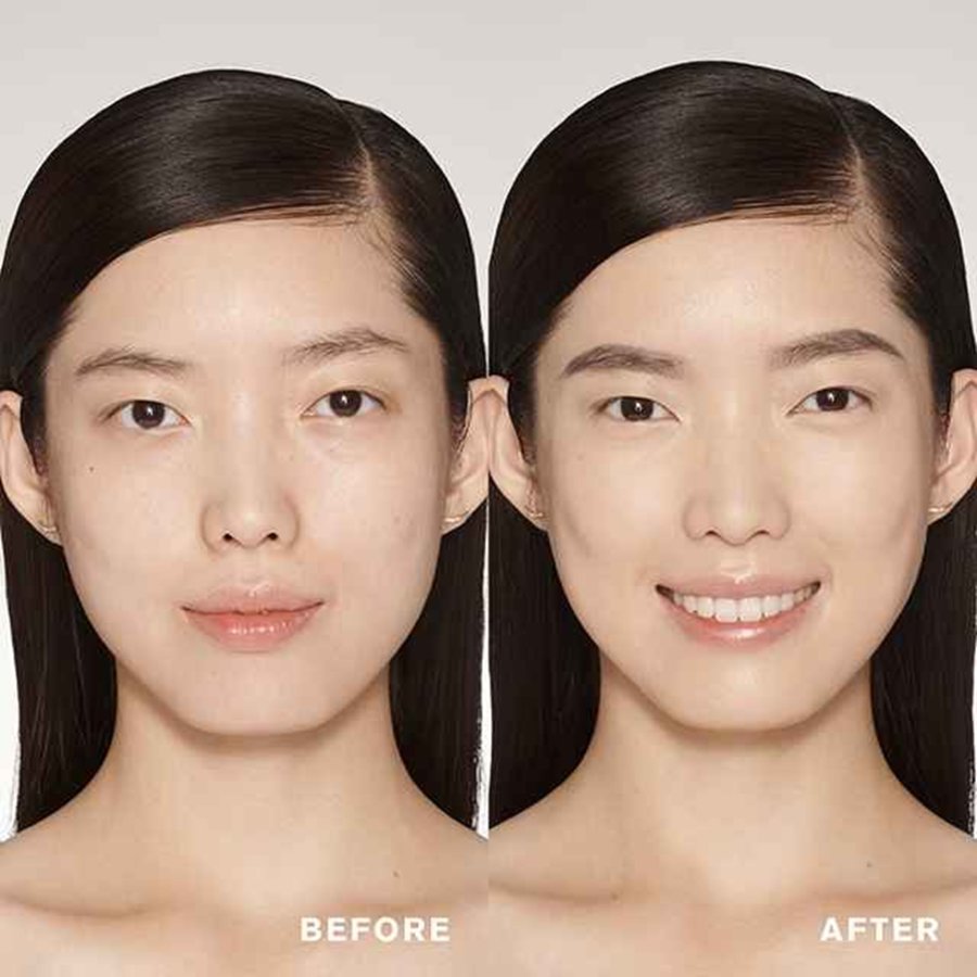 Before and after comparison of a woman's face with a clear division between the two.