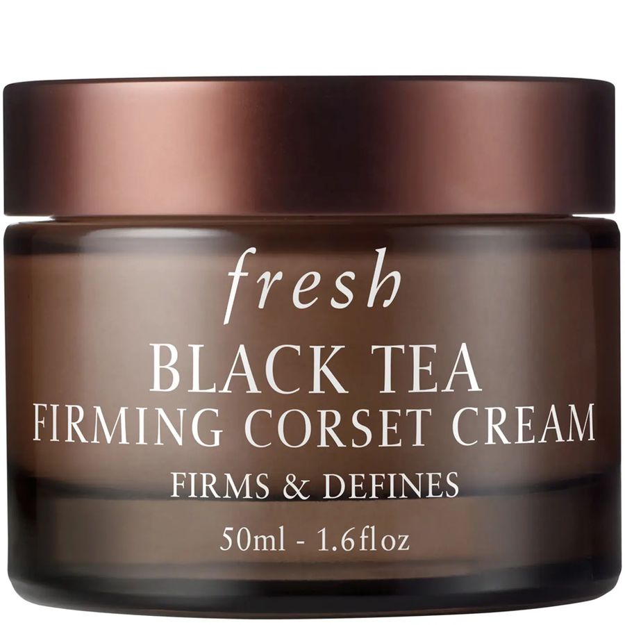 Fresh Black Tea Firming Corset Cream in a dark brown glass jar with a metallic bronze lid, on a white background.