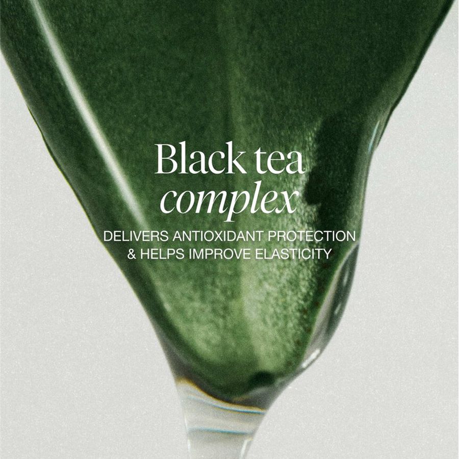 A close-up of a dark green leaf with white text reading 'Black tea complex' and smaller text below about antioxidant protection and elasticity, on a light gray background.