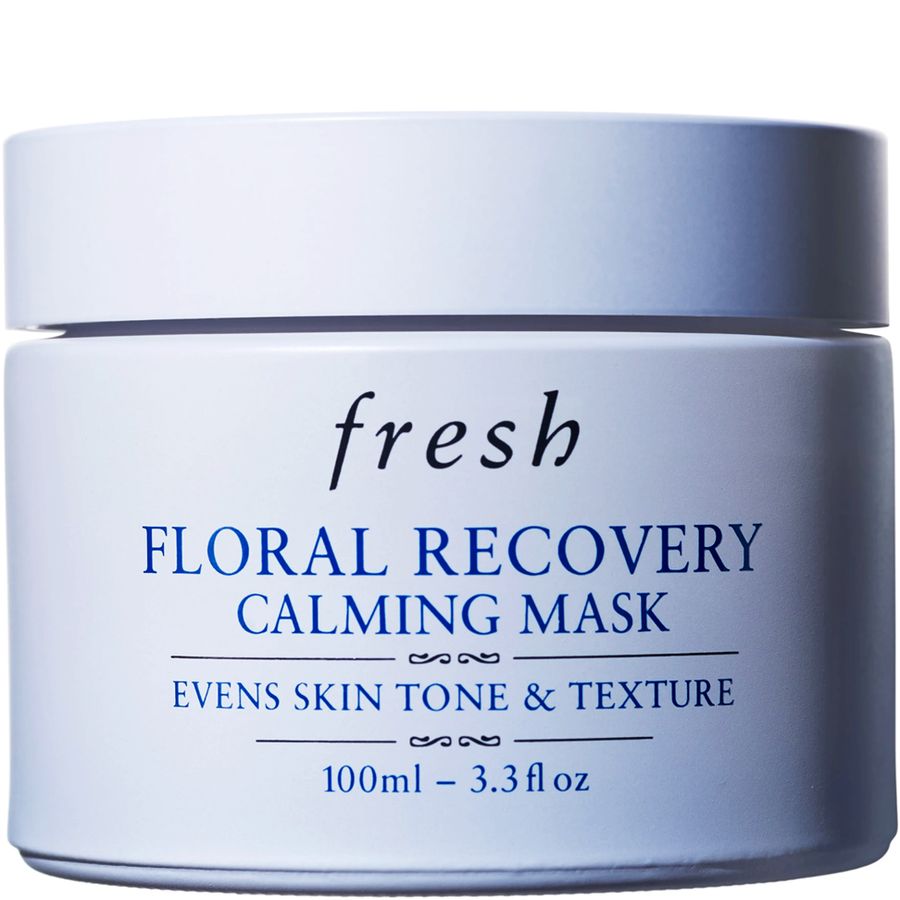 A white cosmetic jar of Fresh Floral Recovery Calming Mask with blue text on a white background.