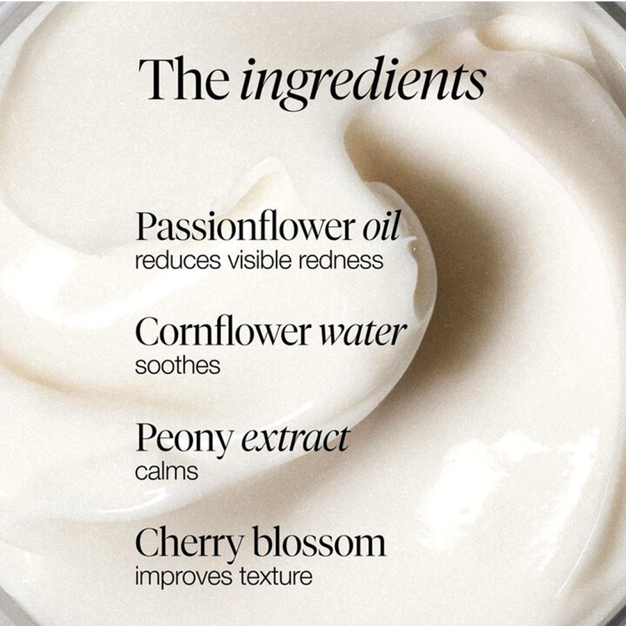 White creamy skincare product with text listing ingredients: Passionflower oil, Cornflower water, Peony extract, and Cherry blossom.