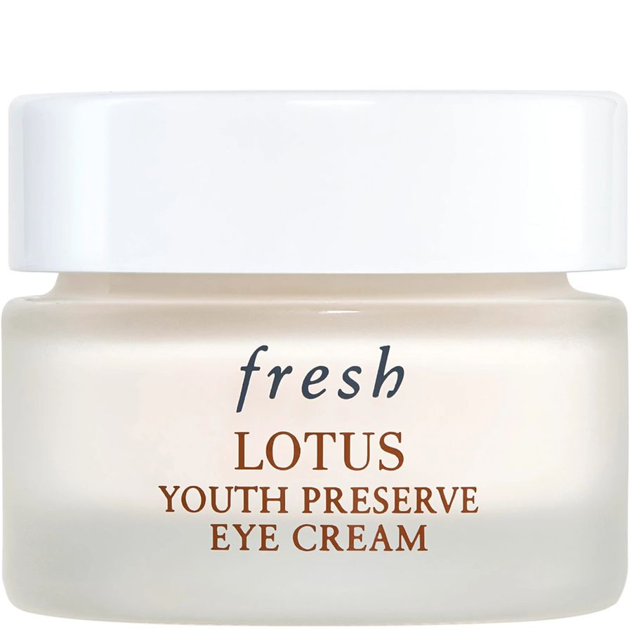 Fresh Lotus Youth Preserve Eye Cream in a frosted glass jar with a white lid, featuring brown and black text on a clean white background.