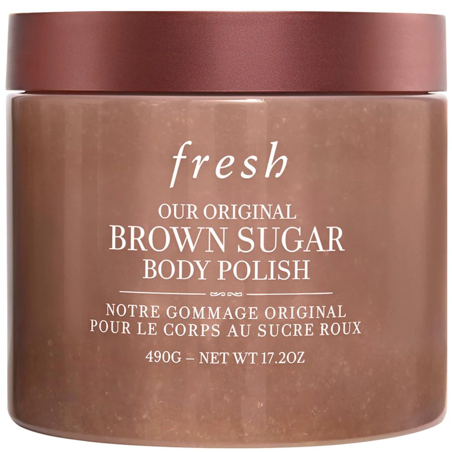 A jar of Fresh Our Original Brown Sugar Body Polish with a metallic rose gold lid and a brown body, featuring white text on the front.