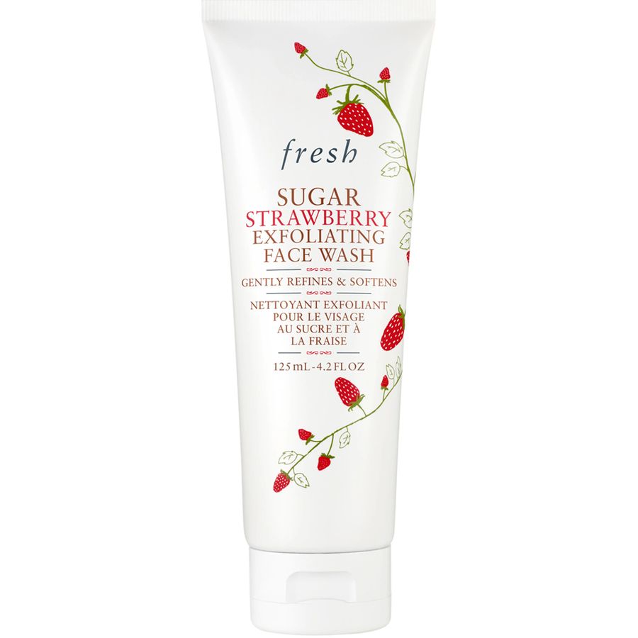 Fresh Sugar Strawberry Exfoliating Face Wash in a white squeeze tube with red and green strawberry illustrations and black and red text.