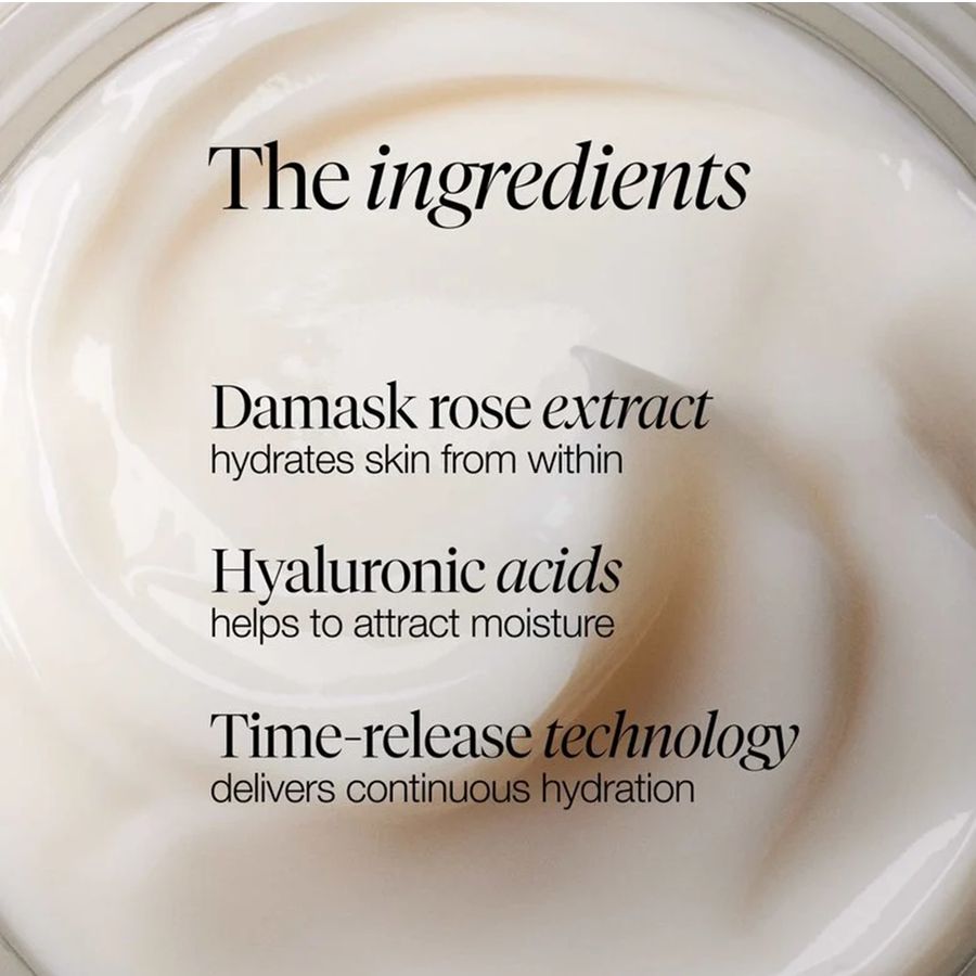Close-up of a white cream or balm surface with overlaid text reading 'The ingredients' and three skincare claims: 'Damask rose extract,' 'Hyaluronic acids,' and 'Time-release technology.' This is not a clean product shot of the container itself and functions as informational marketing imagery, so Instruction Diagram is the best fit among the available categories rather than Product/Packaging.