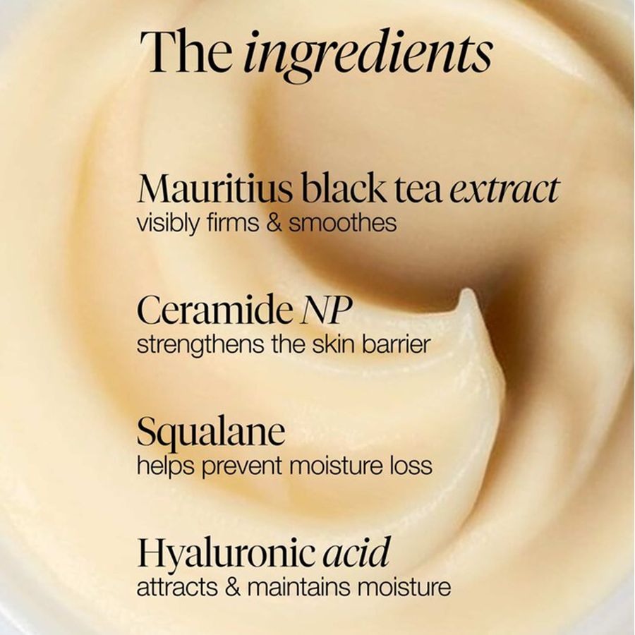 Close-up of a cream-colored skincare product swirl with text listing ingredients: Mauritius black tea extract, Ceramide NP, Squalane, and Hyaluronic acid.