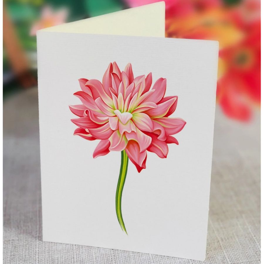 Card with a pink flower illustration on a textured surface