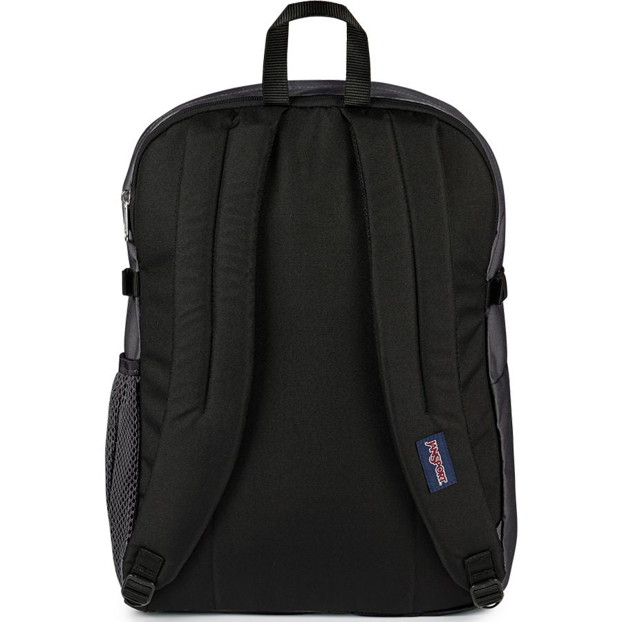Black Janji backpack shown from the back, featuring padded shoulder straps, a top carry handle, side mesh pocket, and a small blue Janji logo patch.