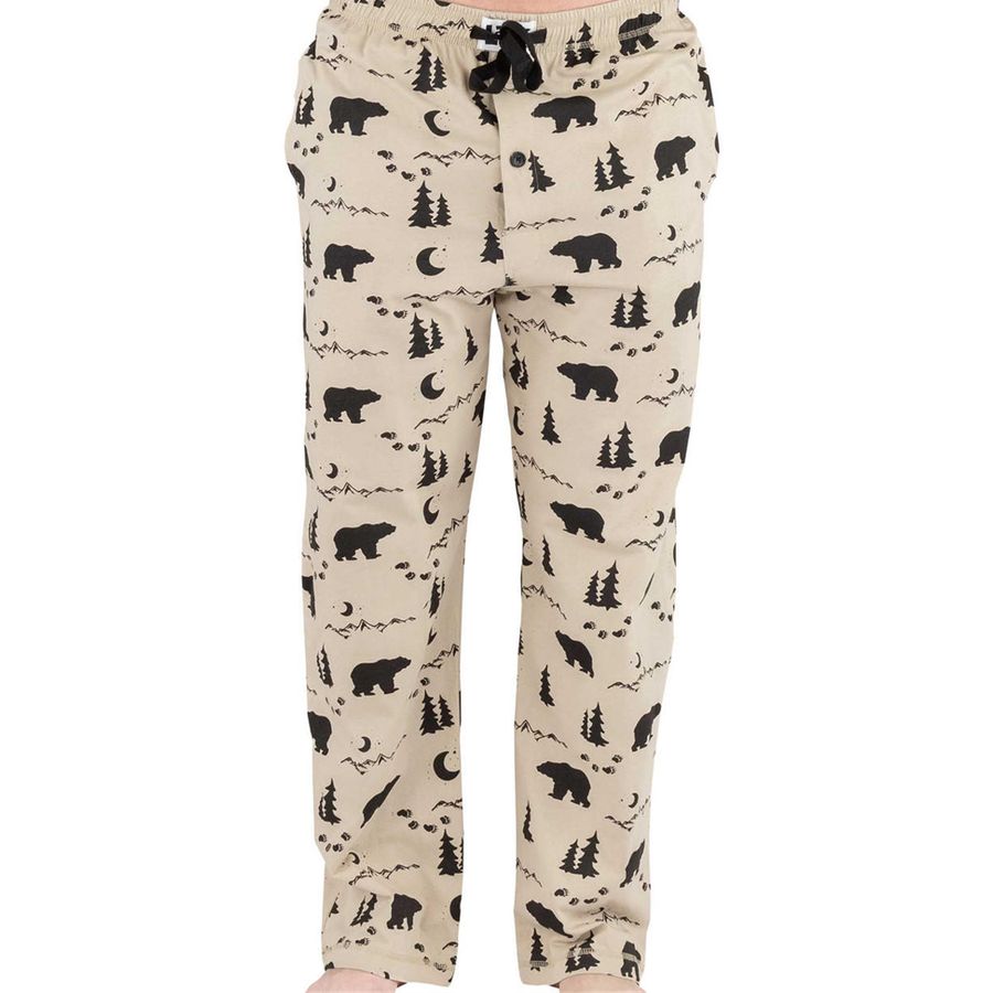 Beige fleece pajama pants with a black woodland print of bears, trees, and moons, featuring a drawstring waistband.