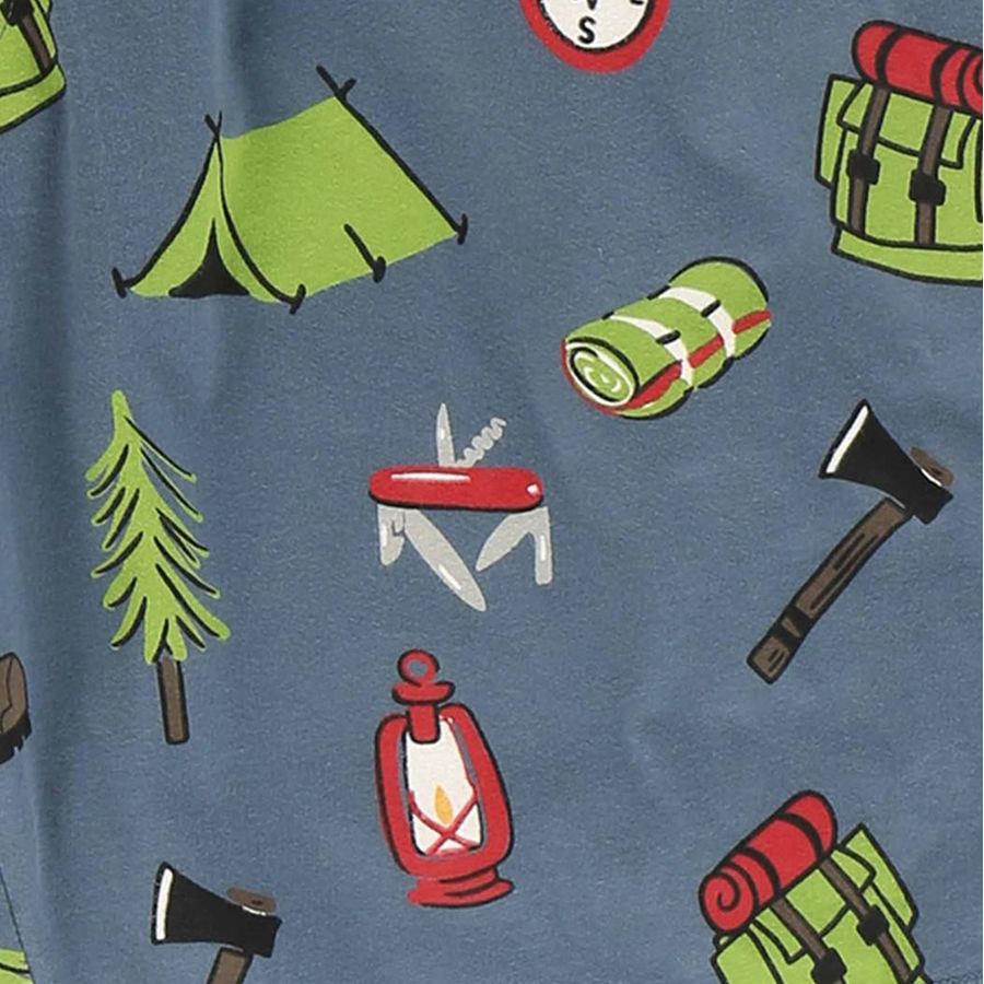 A close-up of a blue fabric with a repeating camping-themed print featuring a green tent, pine tree, red lantern, camping stove, axe, and backpack.