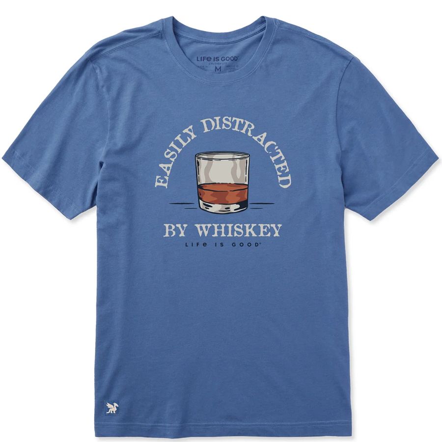 A heather blue crewneck t-shirt featuring a graphic of a whiskey glass with the text 'EASILY DISTRACTED BY WHISKEY' and 'LIFE IS GOOD' printed on the front.