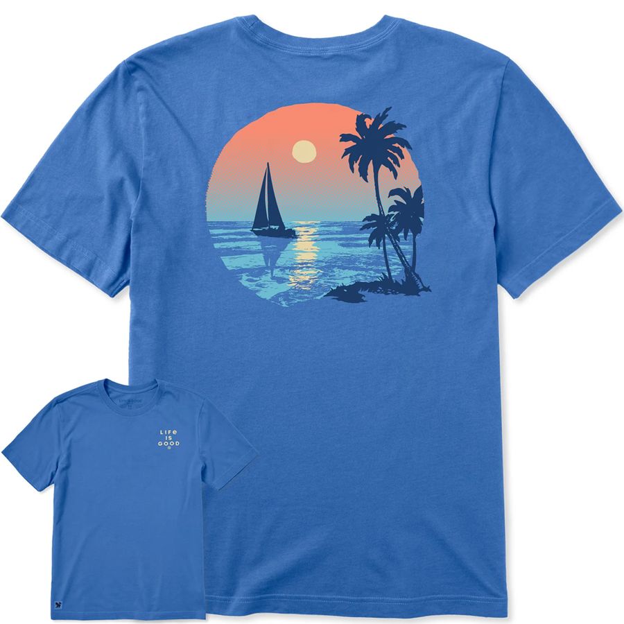 Blue t-shirt with a tropical design featuring a sailboat and palm trees.