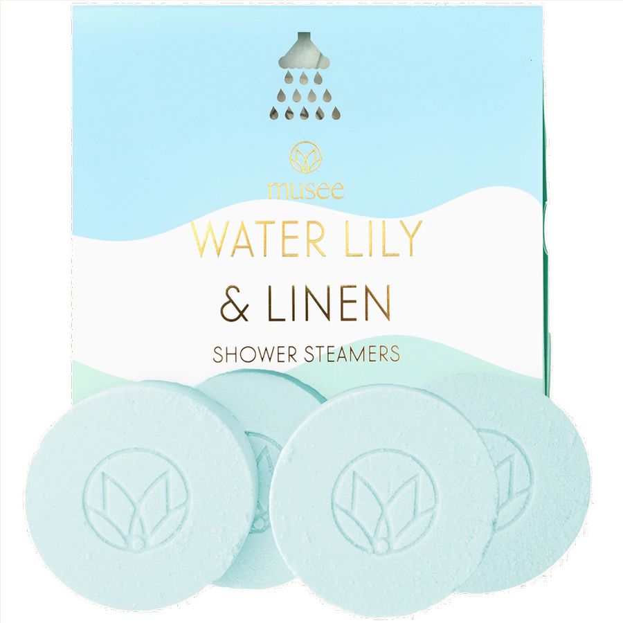 Shower steamers with 'Water Lily & Linen' fragrance packaging on a light blue background