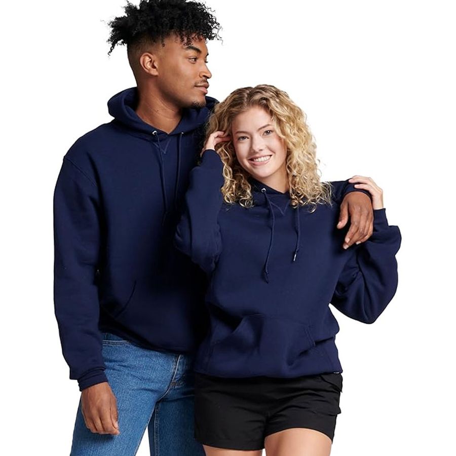 Two people wearing navy blue hoodies on a white background