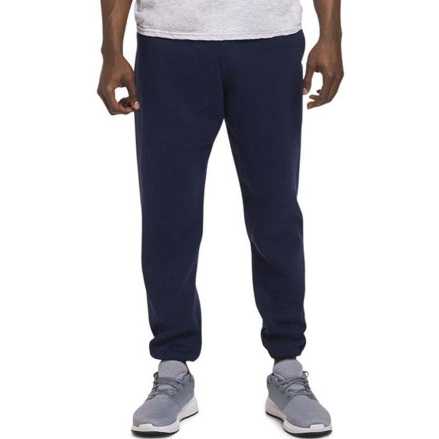 Person wearing navy blue sweatpants on a white background