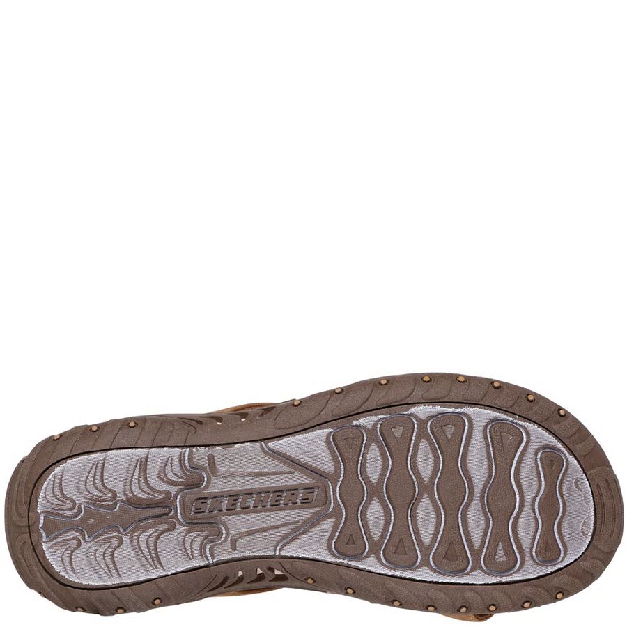 Brown shoe sole with 'Skechers' branding on a white background